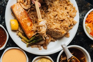 a plate of food with chopsticks