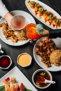 a table with plates of food and drinks