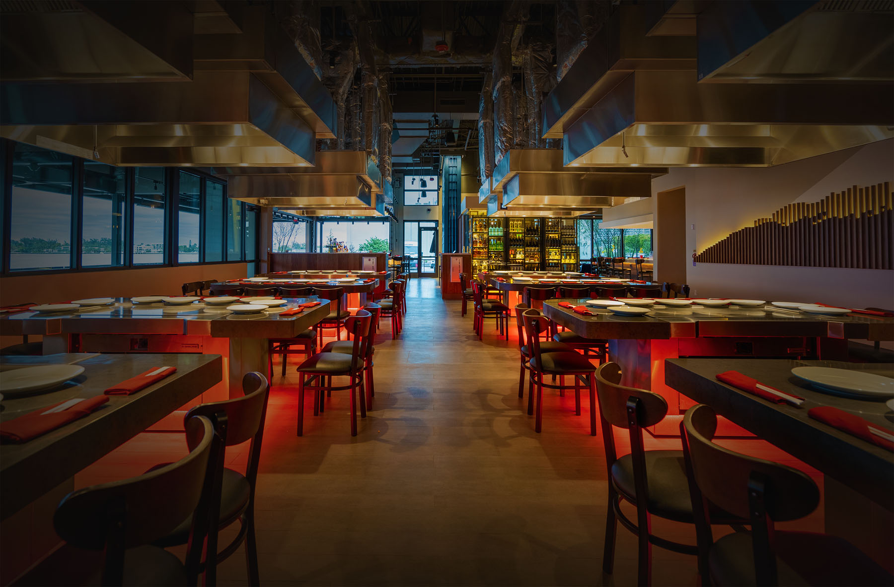 
                    a restaurant with tables and chairs