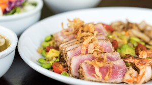 a plate of food with meat and vegetables