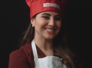 a woman wearing a chef hat