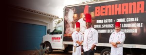 a group of men wearing chef's hats and standing in front of a truck